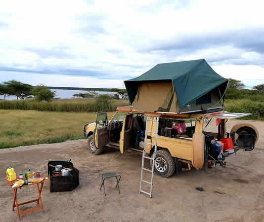 Compare Tanzania 4×4 rental options: self-drive Land Cruisers with rooftop tents, driver-guide hire, budget vans, one-way rentals & border-crossing safaris. From $130/day.